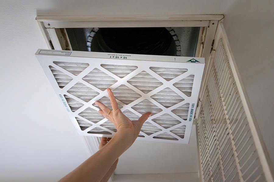 Homeowner Installing New HVAC Air Filter
