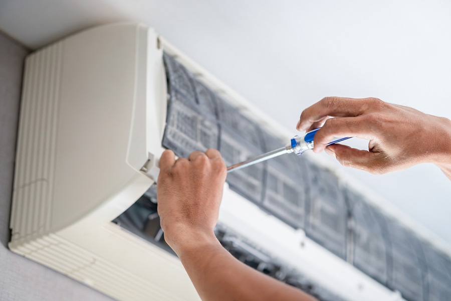 Repairman fix air conditioning systems, Technicians man using screwdrivers service for repair and maintenance of air conditioners